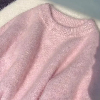 Close-up of a pink sweater with a blurred background